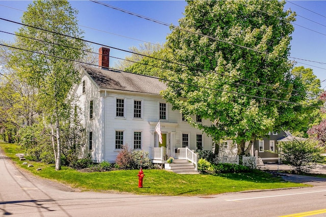 86 High St, Belfast, ME 04915 - colonial house with a chimney and a front yard