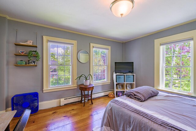 86 High St, Belfast, ME 04915 - bedroom with hardwood / wood-style flooring, a baseboard radiator, ornamental molding, and baseboards