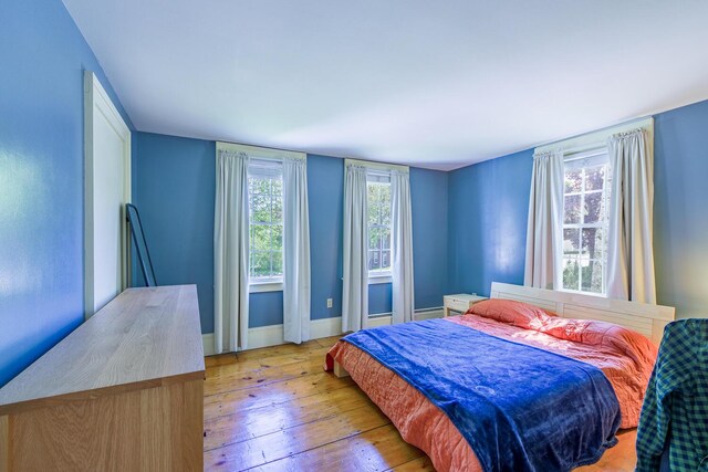 86 High St, Belfast, ME 04915 - bedroom with hardwood / wood-style flooring and baseboards