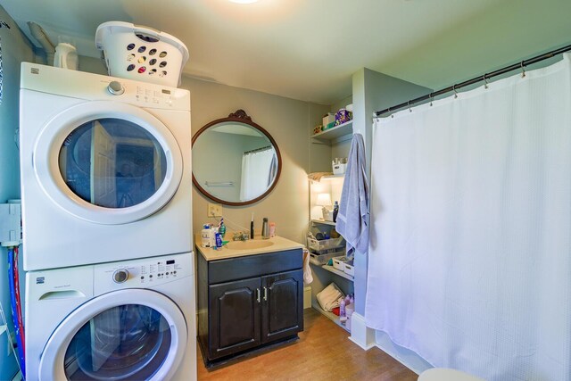 86 High St, Belfast, ME 04915 - laundry area with stacked washing machine and dryer and light wood-style floors