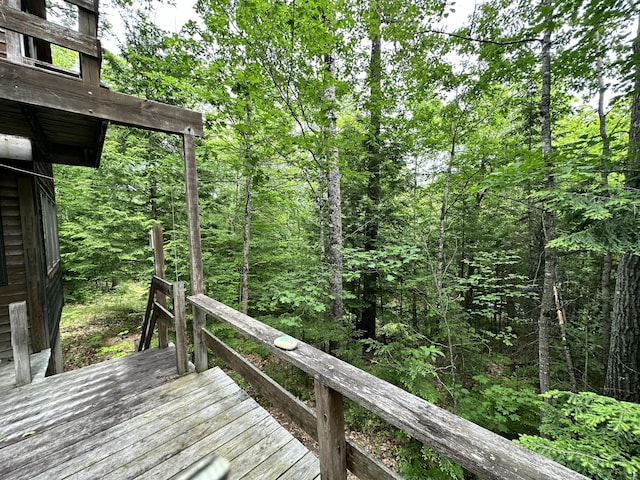 267 Tufts Pond Rd, Kingfield, ME 04947 - wooden terrace featuring a forest view