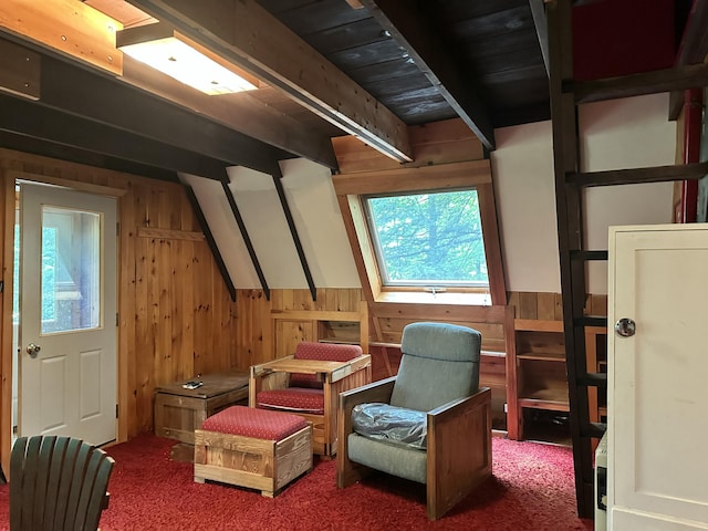 267 Tufts Pond Rd, Kingfield, ME 04947 - living area featuring wood walls, plenty of natural light, carpet flooring, and beam ceiling