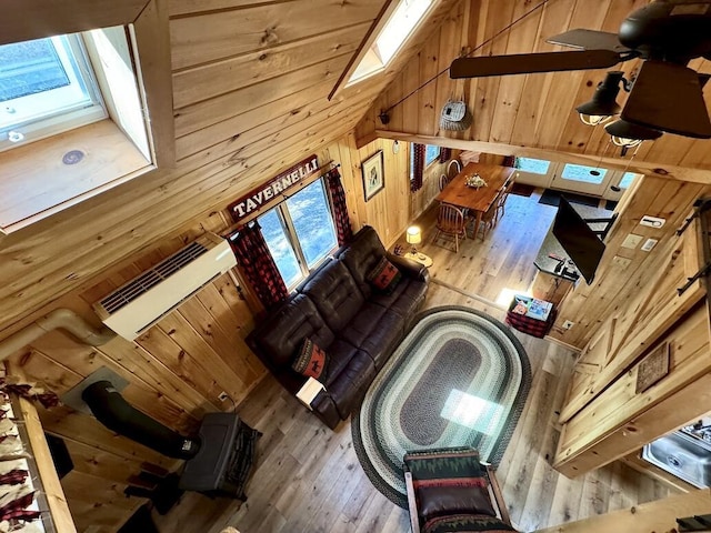 133 Camp Waya-Awi Rd, Rangeley, ME 04970 - living area with hardwood / wood-style flooring, wooden walls, and a skylight