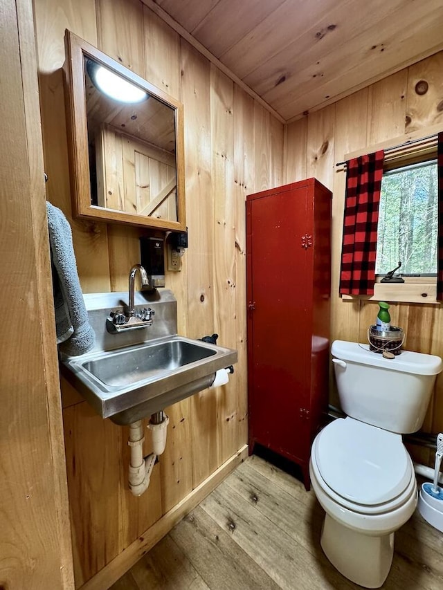 133 Camp Waya-Awi Rd, Rangeley, ME 04970 - half bath featuring wood finished floors, wooden ceiling, and wood walls