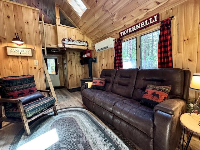 133 Camp Waya-Awi Rd, Rangeley, ME 04970 - living area with a wall mounted air conditioner, hardwood / wood-style floors, lofted ceiling, wooden walls, and wood ceiling