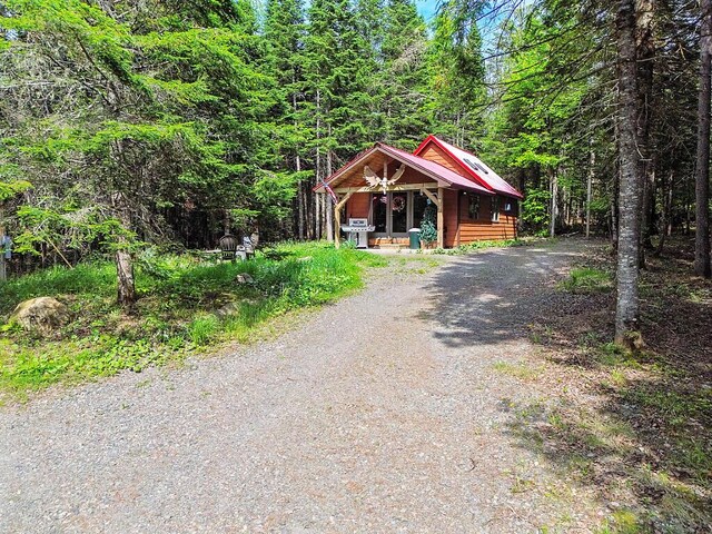 133 Camp Waya-Awi Rd, Rangeley, ME 04970 - chalet / cabin with driveway and a forest view