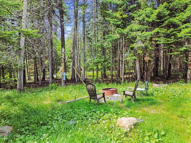 133 Camp Waya-Awi Rd, Rangeley, ME 04970 - view of yard featuring a fire pit