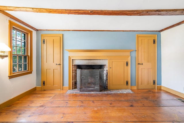 16 Old Village Rd, Winthrop, ME 04364 - unfurnished living room featuring crown molding, wood-type flooring, and a fireplace with flush hearth