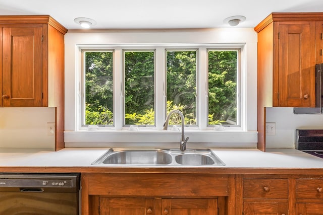 16 Old Village Rd, Winthrop, ME 04364 - kitchen with dishwasher, light countertops, healthy amount of natural light, and brown cabinets