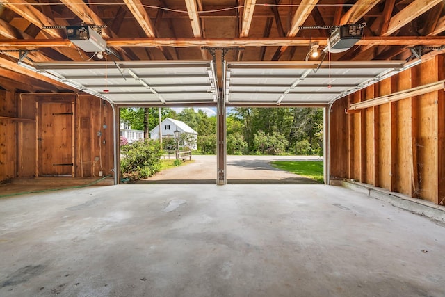 16 Old Village Rd, Winthrop, ME 04364 - garage featuring a garage door opener