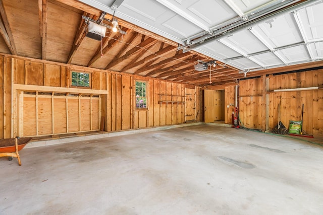 16 Old Village Rd, Winthrop, ME 04364 - garage featuring a garage door opener