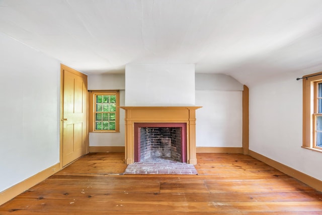 16 Old Village Rd, Winthrop, ME 04364 - unfurnished living room featuring hardwood / wood-style flooring, a fireplace, and lofted ceiling