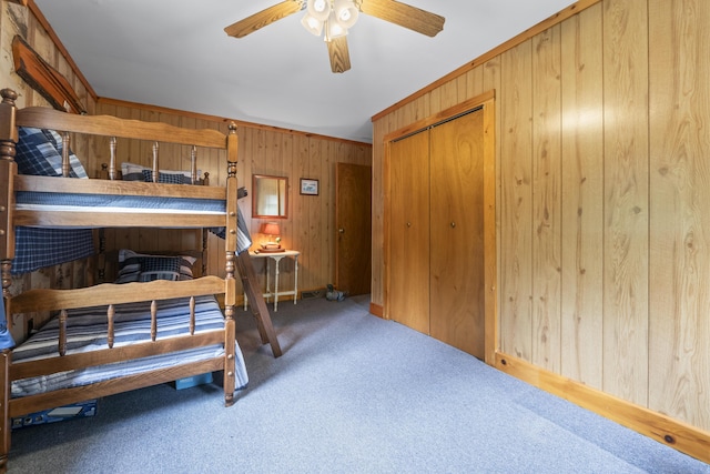 7 Kincaid Ln, Newfield, ME 04095 - bedroom featuring wood walls, carpet, a closet, and ceiling fan