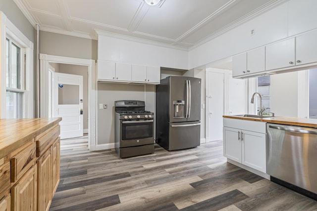 2 Stobie St, Winslow, ME 04901 - kitchen with appliances with stainless steel finishes, light wood-type flooring, white cabinetry, and butcher block countertops