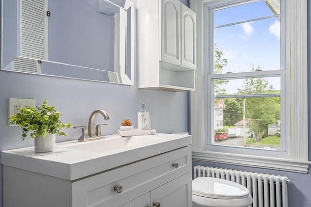 2 Stobie St, Winslow, ME 04901 - half bathroom with radiator and vanity