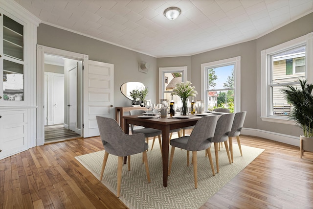 2 Stobie St, Winslow, ME 04901 - dining room with crown molding and light wood-style floors