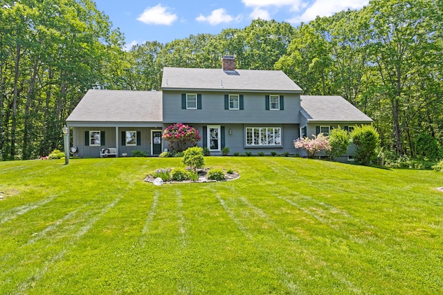 6 Hackmatack Dr, Scarborough, ME 04074 - colonial house featuring a chimney and a front lawn