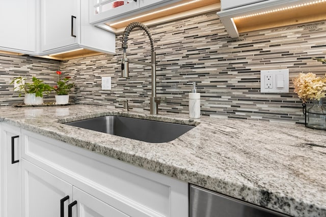 6 Hackmatack Dr, Scarborough, ME 04074 - kitchen with decorative backsplash, white cabinetry, dishwasher, and light stone counters