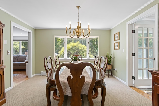 6 Hackmatack Dr, Scarborough, ME 04074 - dining space with a chandelier, light carpet, plenty of natural light, baseboard heating, and crown molding