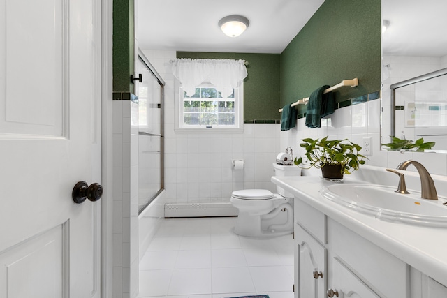 6 Hackmatack Dr, Scarborough, ME 04074 - full bath featuring baseboard heating, vanity, tile patterned floors, tile walls, and bath / shower combo with glass door