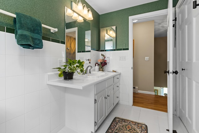 6 Hackmatack Dr, Scarborough, ME 04074 - bathroom with tile patterned flooring, vanity, tile walls, and a baseboard heating unit