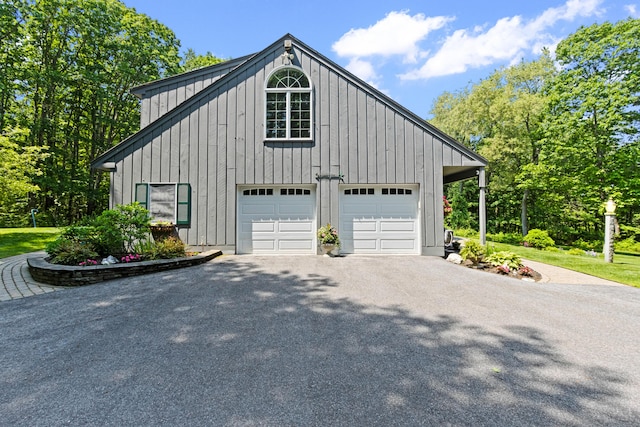 6 Hackmatack Dr, Scarborough, ME 04074 - view of home's exterior featuring board and batten siding, a garage, and driveway