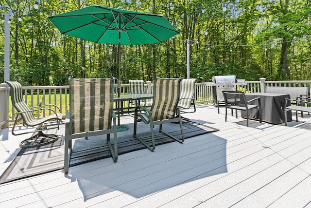 6 Hackmatack Dr, Scarborough, ME 04074 - wooden deck featuring area for grilling, view of scattered trees, and outdoor dining space