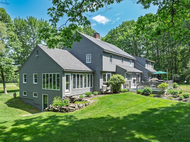 6 Hackmatack Dr, Scarborough, ME 04074 - back of house with a deck, a chimney, a lawn, and a shingled roof