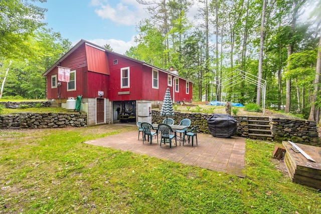 60 Watson Hill Rd, Limerick, ME 04048 - rear view of property with a patio area, a chimney, a lawn, view of scattered trees, and a swimming pool