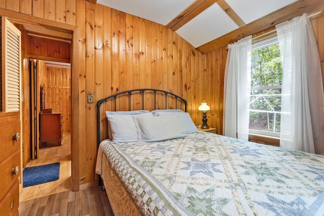 60 Watson Hill Rd, Limerick, ME 04048 - bedroom with wood walls, wood finished floors, and lofted ceiling