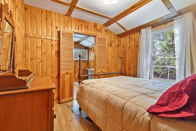 60 Watson Hill Rd, Limerick, ME 04048 - bedroom with wooden walls and light wood-type flooring