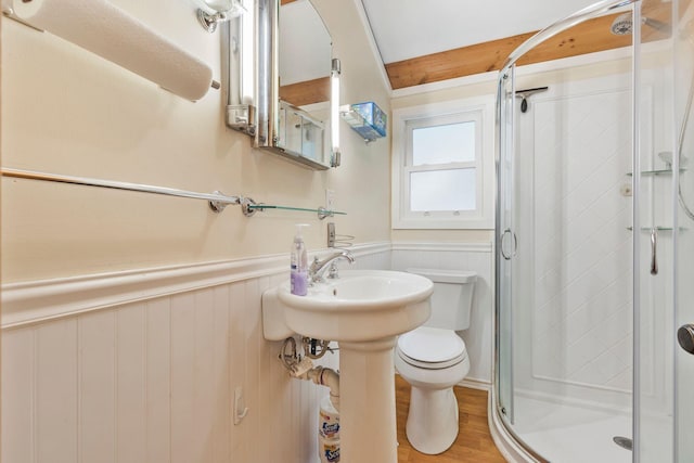 60 Watson Hill Rd, Limerick, ME 04048 - bathroom featuring a wainscoted wall, a stall shower, wood finished floors, and a decorative wall