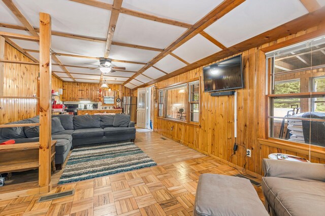60 Watson Hill Rd, Limerick, ME 04048 - living room with wood walls and ceiling fan