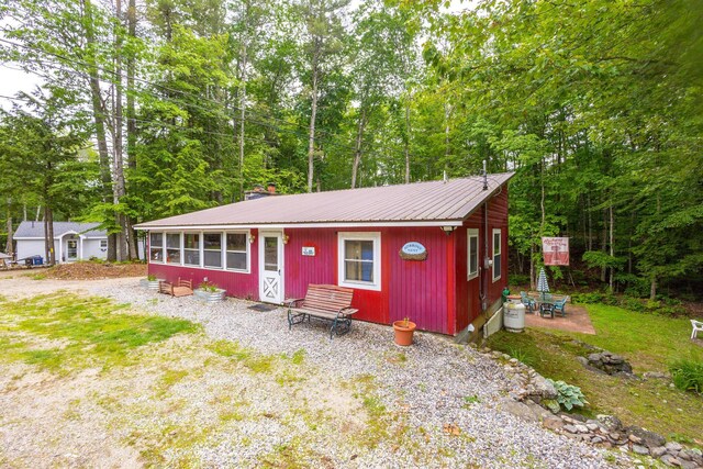60 Watson Hill Rd, Limerick, ME 04048 - view of front facade featuring a metal roof and a chimney