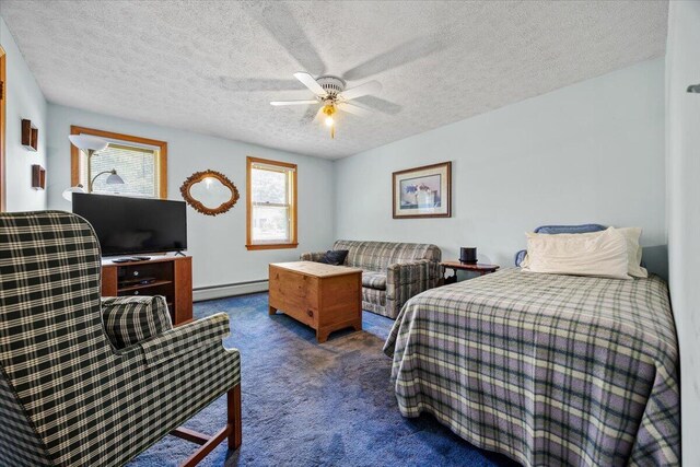 52 Douglas Ave, Saco, ME 04072 - bedroom with a baseboard radiator, carpet flooring, a textured ceiling, and a ceiling fan