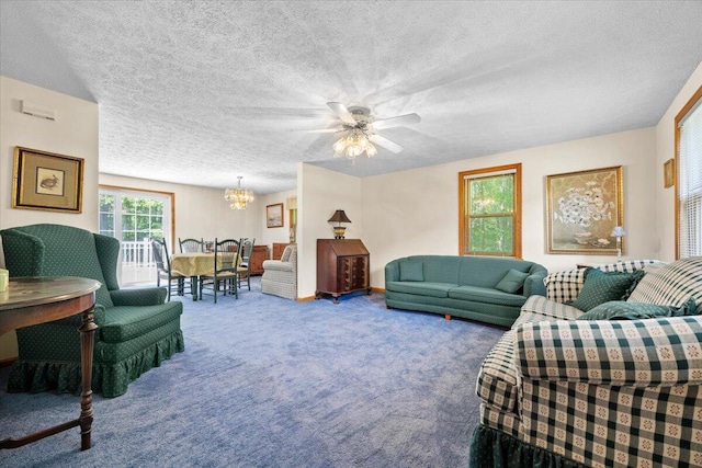 52 Douglas Ave, Saco, ME 04072 - living area featuring a chandelier, carpet floors, a textured ceiling, and ceiling fan