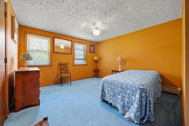 52 Douglas Ave, Saco, ME 04072 - carpeted bedroom featuring baseboard heating, a textured ceiling, and ceiling fan