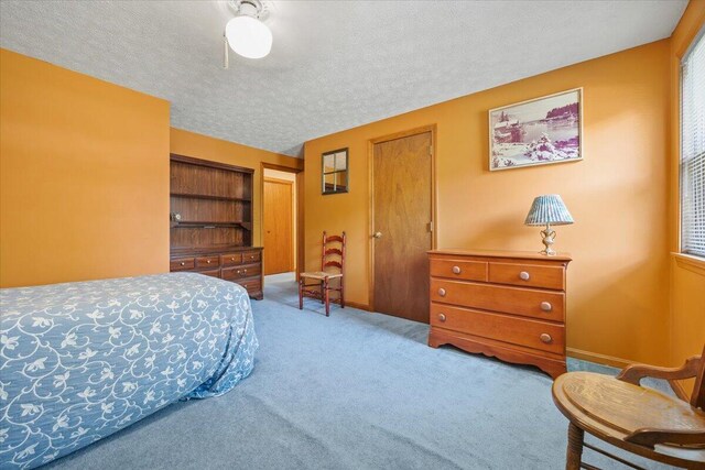 52 Douglas Ave, Saco, ME 04072 - carpeted bedroom featuring a textured ceiling and baseboards