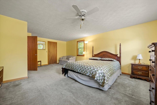 52 Douglas Ave, Saco, ME 04072 - carpeted bedroom with multiple windows, a textured ceiling, and a ceiling fan