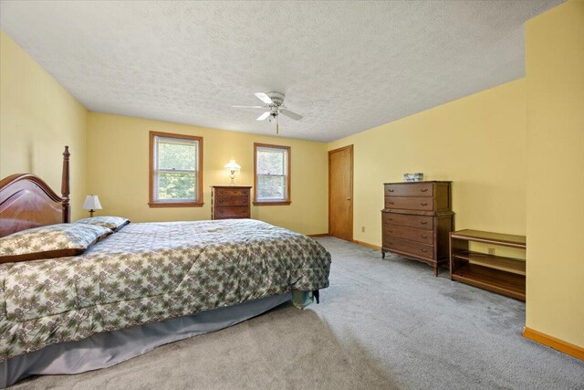 52 Douglas Ave, Saco, ME 04072 - bedroom with carpet floors, a textured ceiling, and a ceiling fan