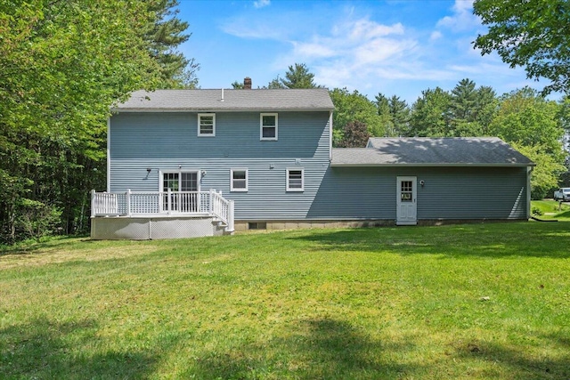 52 Douglas Ave, Saco, ME 04072 - back of house with a wooden deck, a lawn, and a chimney
