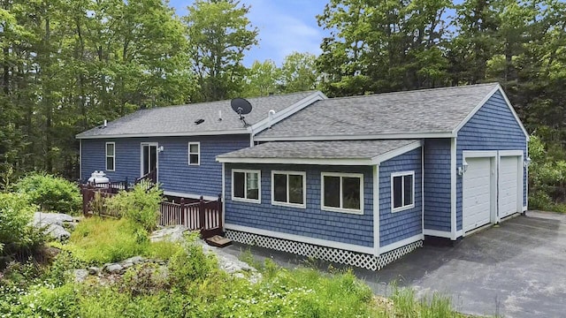 282 Back Narrows Rd, Boothbay, ME 04537 - back of property with a shingled roof, a garage, and a wooden deck