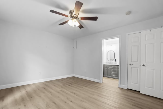 282 Back Narrows Rd, Boothbay, ME 04537 - unfurnished bedroom with light wood finished floors, ensuite bath, and ceiling fan