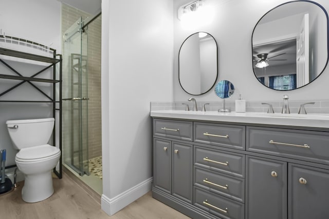 282 Back Narrows Rd, Boothbay, ME 04537 - bathroom with a ceiling fan, double vanity, a shower stall, and wood finished floors