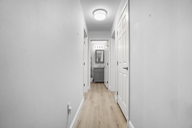 282 Back Narrows Rd, Boothbay, ME 04537 - corridor with light wood finished floors and baseboards