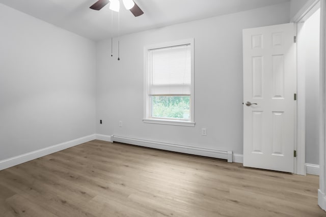 282 Back Narrows Rd, Boothbay, ME 04537 - unfurnished room with baseboard heating, light wood-style flooring, and ceiling fan