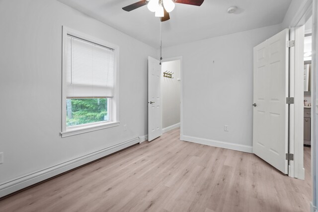 282 Back Narrows Rd, Boothbay, ME 04537 - unfurnished bedroom featuring baseboard heating, light wood-style floors, and ceiling fan