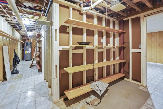 282 Back Narrows Rd, Boothbay, ME 04537 - unfinished below grade area featuring hybrid water heater and wood walls