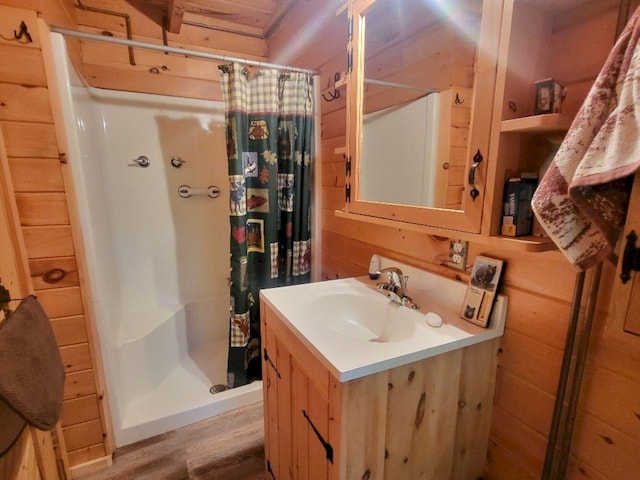 40 Griffin Mountain Rd, New Vineyard, ME 04956 - bathroom with a stall shower, vanity, and wood finished floors