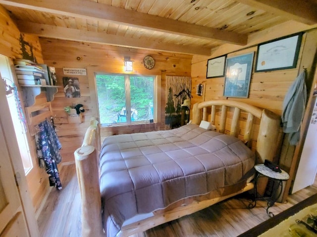 40 Griffin Mountain Rd, New Vineyard, ME 04956 - bedroom featuring wooden walls, wood finished floors, and a wood ceiling with exposed beams